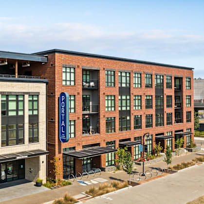 A modern building with a blue sign on the front.