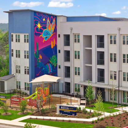A large building with a mural on the side of it.
