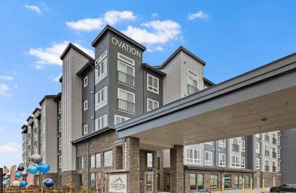 A modern building with the word "Ovation" on it.