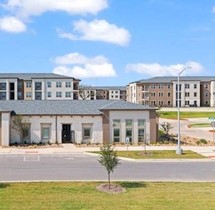 a large building with a street in front of it