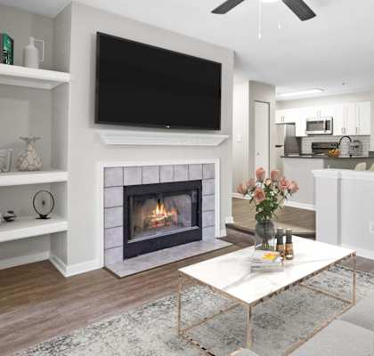 a living room with a fireplace and a tv