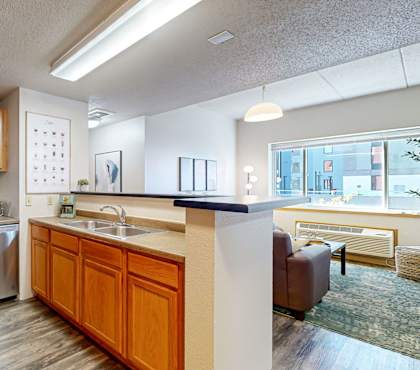 a kitchen with stainless steel appliances and wooden cabinets