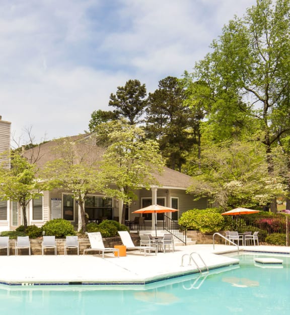 a house with a pool in front of it