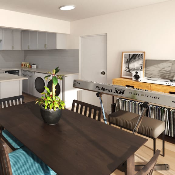 A modern kitchen with a dining table and chairs at Ocean Edge @ Laguna Beach Apartments, California, 92651