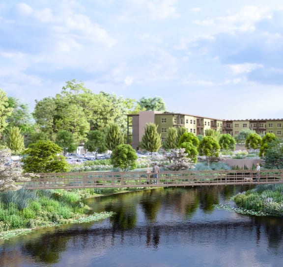 a rendering of an apartment building next to a body of water at Boardwalk at Research Park, Alabama, 35811