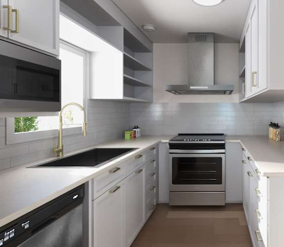 A modern kitchen with white cabinets and stainless steel appliances. at Ocean Edge @ Laguna Beach Apartments, Laguna Beach
