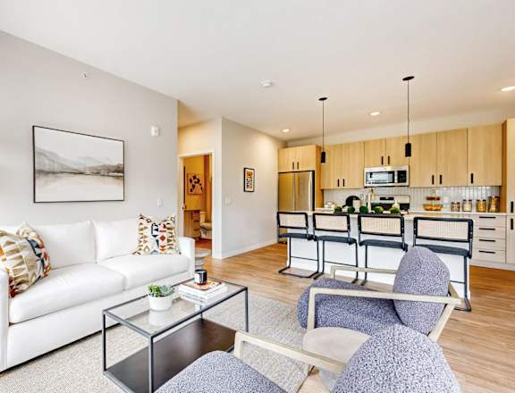 a living room with a couch and a glass table
