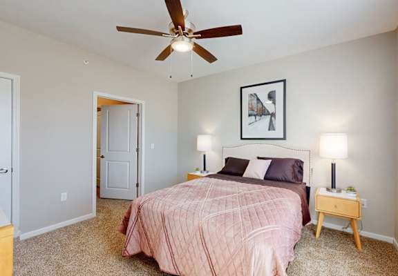 a bedroom with a bed and a ceiling fanat The Slate, Jeffersonville, 47130