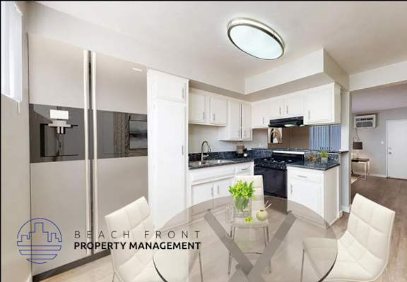 A modern kitchen with a dining table and chairs.