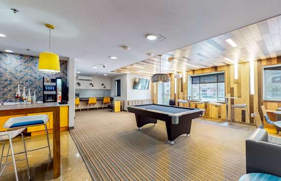 a game room with a pool table and a bar, Student Housing in Minneapolis