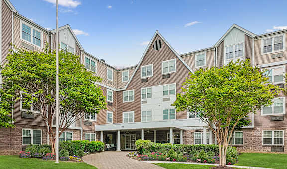 A large apartment complex with a landscaped front yard.