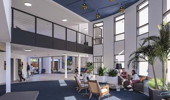 A group of people are sitting in a modern office space.