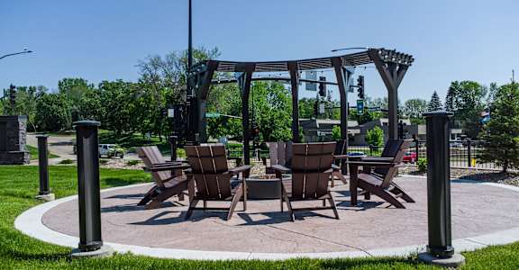 a patio with chairs and a table on a patio