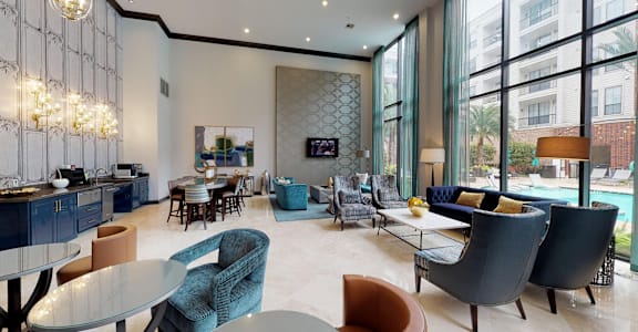 A modern living room with a pool outside the window.