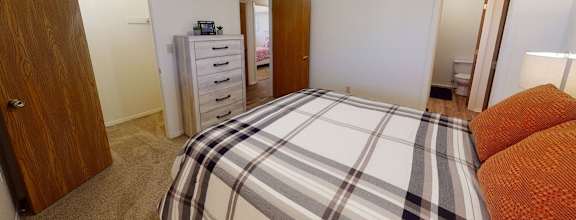 a bedroom with a bed and a closet  at Antelope Ridge, South Dakota