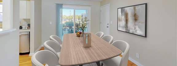A dining room with a table and chairs.