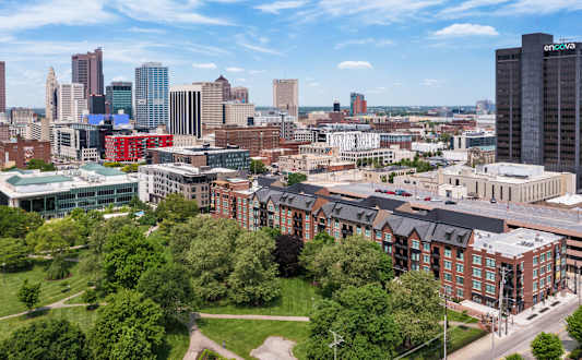 an aerial view of the city with buildings and trees