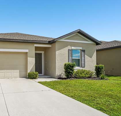 A house with a garage and a driveway.