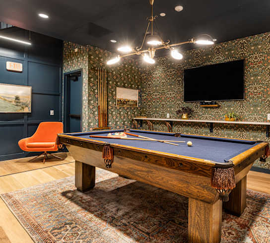 a game room with a pool table and a tv at The Commonwealth Building, Pittsburgh, Pennsylvania