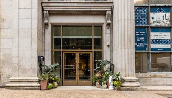 The front of a building with a sign at The Commonwealth Building, Pittsburgh, 15222
