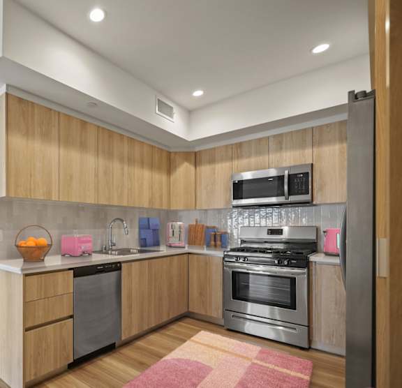 A modern kitchen with wooden cabinets and stainless steel appliances.