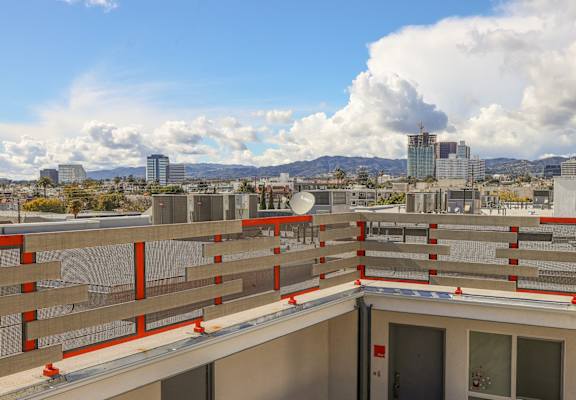 the view of the city from the roof of a building