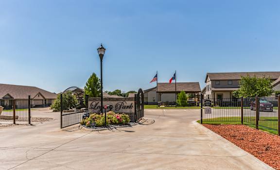 our apartments are located at the end of a driveway with a gate