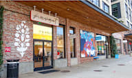 A storefront with a sign that says "Ferment" above the door.