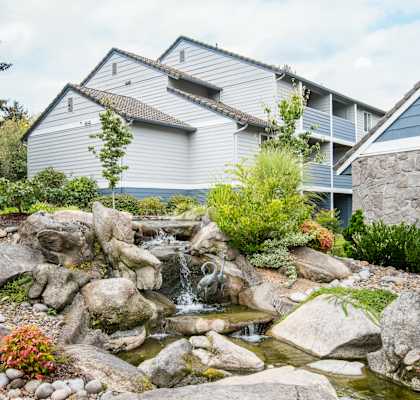 A small waterfall in a rock garden in front of Creekside Village in Euguene, OR.