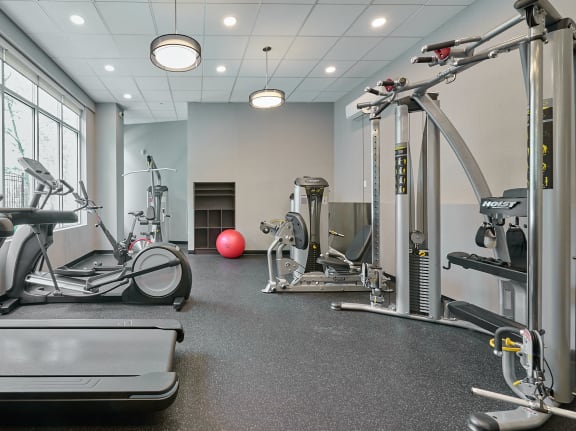 a room with a bunch of exercise equipment in it