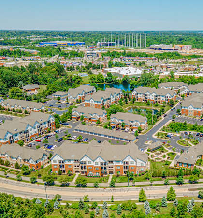 an aerial view of a suburb of a city with houses and roads