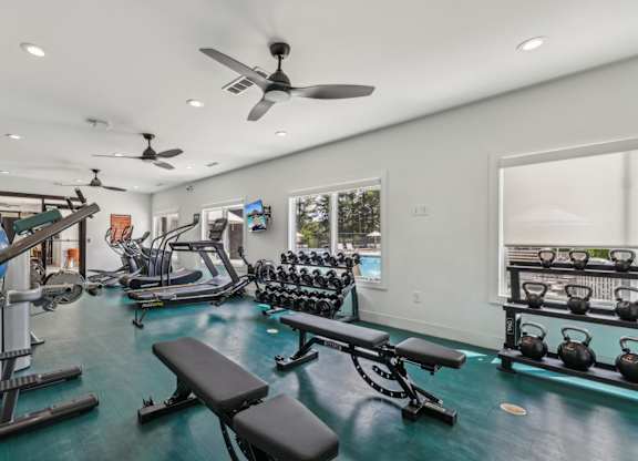 A well-equipped home gym with a variety of exercise equipment.