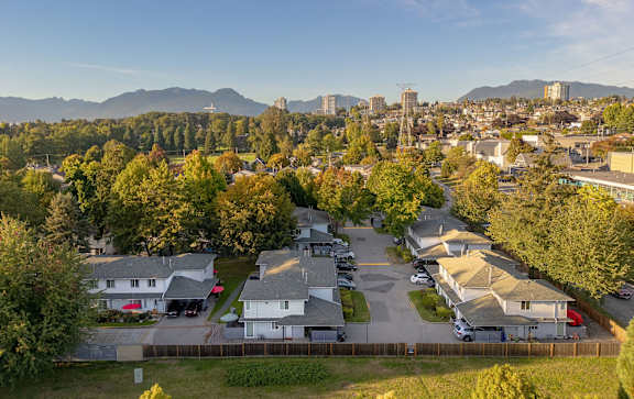 an aerial view of a neighborhood with houses and trees