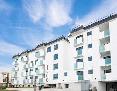 A modern white building with the number 1500 on it.
