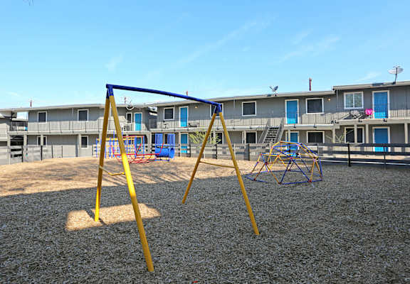 a playground at the whispering winds apartments in pearland, tx