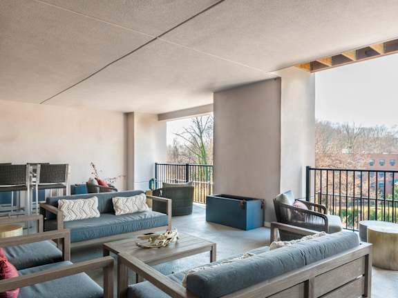 A modern living room with a large sofa and a coffee table.