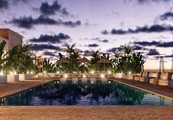 a pool at night at the sheraton australia hotel on the beach