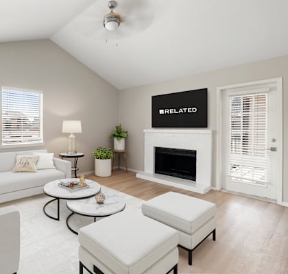 a living room with a white couch and a fireplace