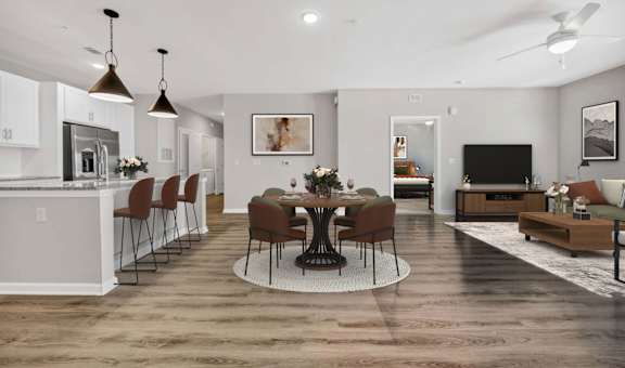 A modern kitchen with a dining table set for four.