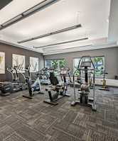 A gym with a variety of exercise equipment.