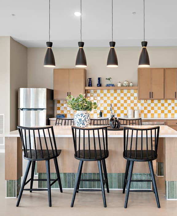 Open concept clubhouse with dining and lounge areas at Reserve At Settlers Ridge Apartments, Minnesota