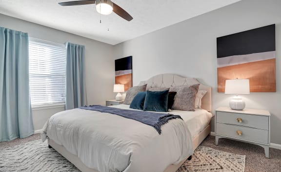 a bedroom with a bed and a ceiling fan at Enclave at Breckenridge Apartments, Louisville, KY