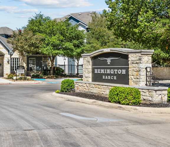 the building where the hotel is located has a sign that says at Remington Ranch, San Antonio, TX, 78247