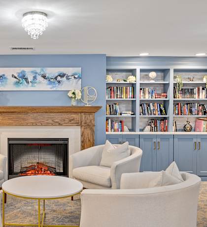 a living room with a fireplace and couches