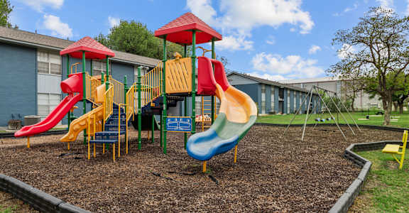 a playground at the whispering winds apartments in pearland, tx  at Sunset Heights, San Antonio, TX