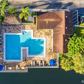 a top down view of the resort with a swimming pool