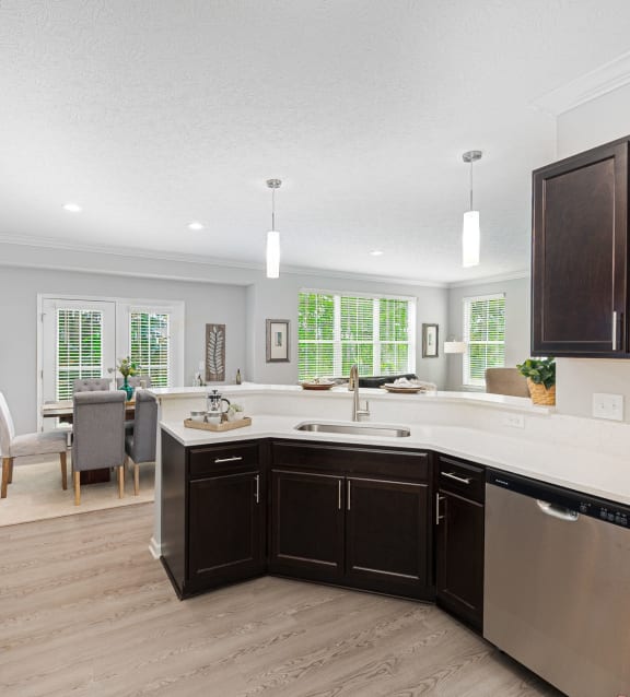a kitchen and living room with a large counter top