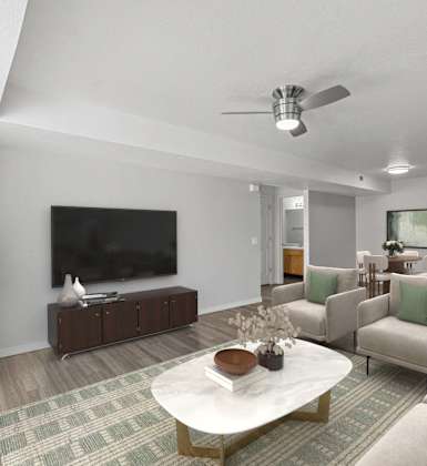 A living room with a white coffee table and a green couch. at Eagles Landing, Ammon, ID