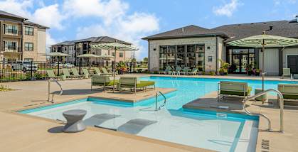 our apartments offer a swimming pool with chairs and umbrellas