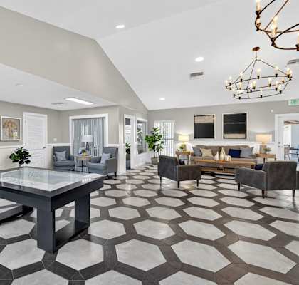 A spacious living room with a large table and chairs. at Cascades at Clear Lake Apartments, Florida, 33908